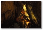 Cave entrance. The passage is wide and a walkway has been built to allow access. Before 1991, the lack of this passage prevented entry into the cave.