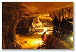 Cave entrance. The passage is wide and a walkway has been built to allow access. Before 1991, the lack of this passage prevented entry into the cave.